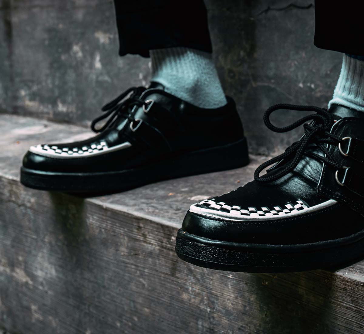 Close-up of man wearing mod-style shoes with thick soft soles