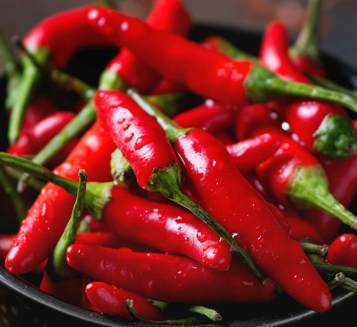 A bowl of bright red chilli peppers, nice!