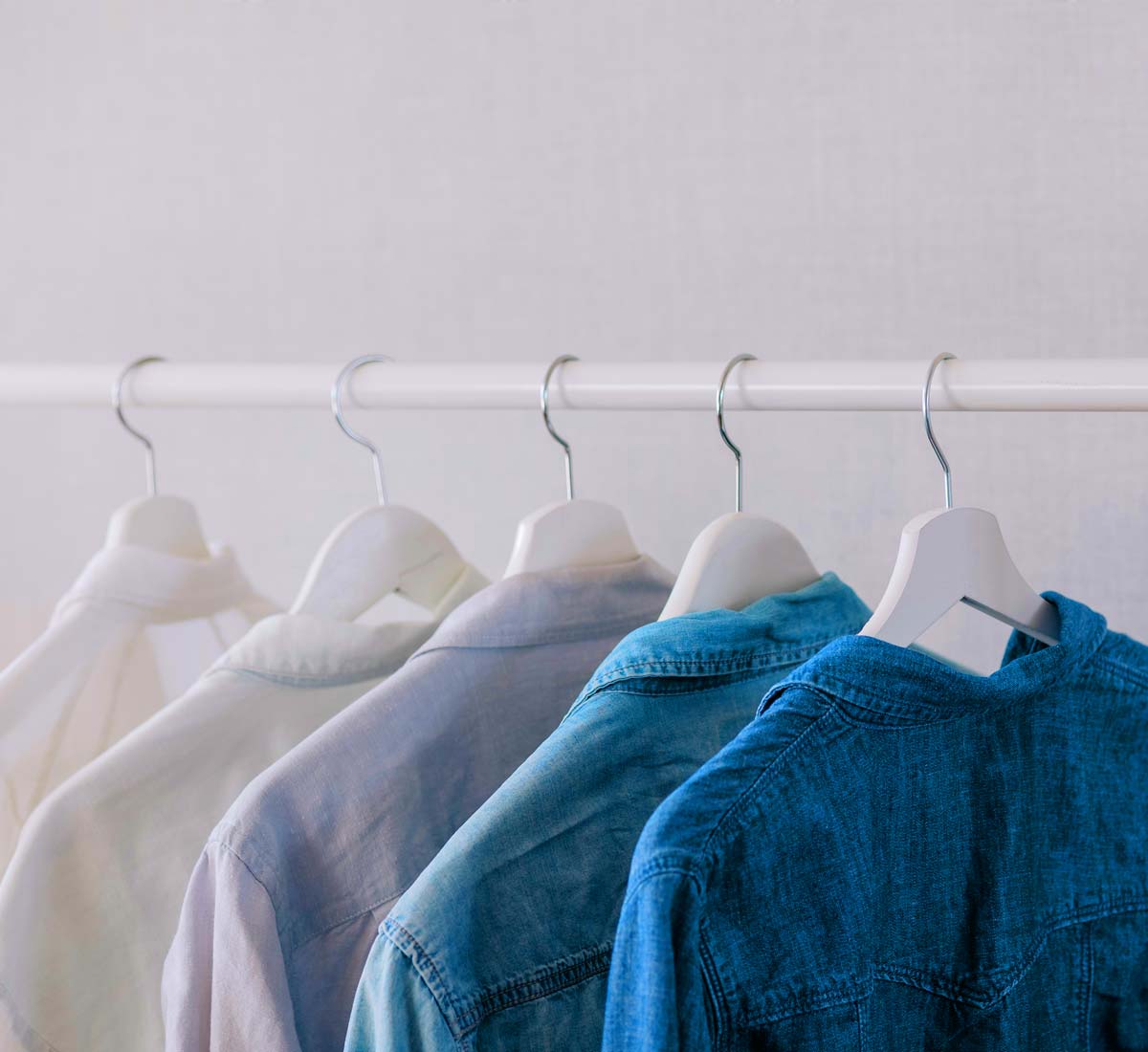 Selection of ladies shirts having on a clothes rail