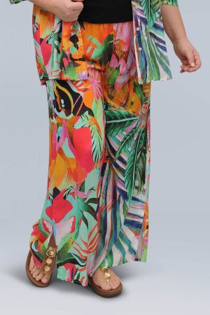 The model in this photo is wearing funky lightweight wide Rio rainforest print trousers from Bakou London for larger sizes
