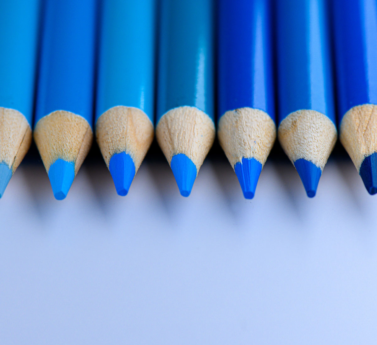 Close up of a selection of different blue coloured pencils