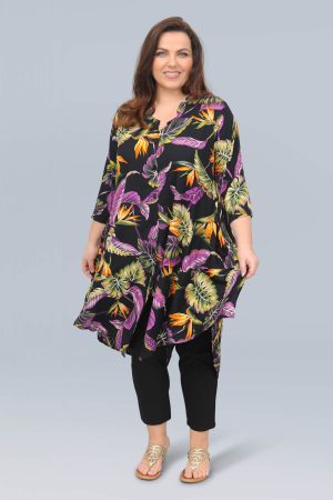The model in this photo is wearing a long asymmetrical tropical print jacket from plus size experts Angel Circle at Bakou