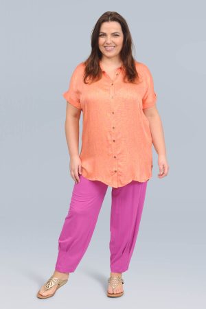 The model in this photo is wearing a silky soft short sleeved shirt by plus size experts Ciso at Bakou