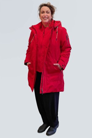 The model in this photo is wearing a shower proof red jacket with insert detail from Frandsen