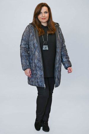 The model in this photo is wearing a Frandsent snake print reversible jacket made from recycled plastic