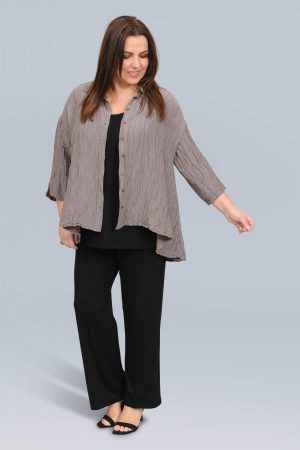 The model in this photo is wearing a silk and linen shirt from luxury brand Grizas at Bakou London