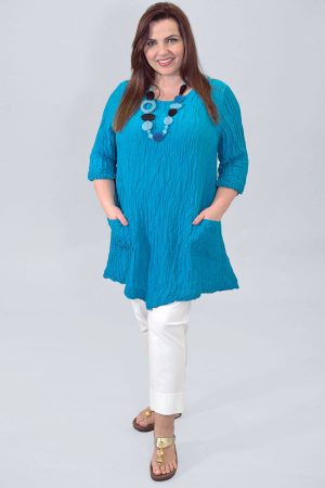 The model in this photo is wearing a two pocket silk and linen tunic with two pockets from Grizas