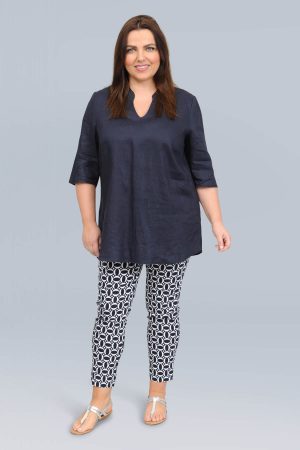 The model in this photo is wearing a linen tunic with kaftan neckline from German plus size specialists K J Brand from Bakou London
