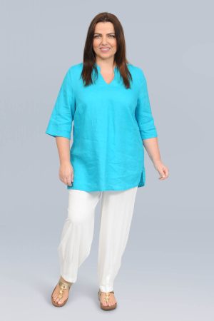 The model in this photo is wearing a linen tunic with kaftan neckline from German plus size specialists K J Brand from Bakou London