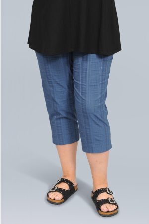 The model in this photo is wearing a pair of K J Brand lightweight Wash & Go capri pants or pedal pushers in plus sizes at Bakou London