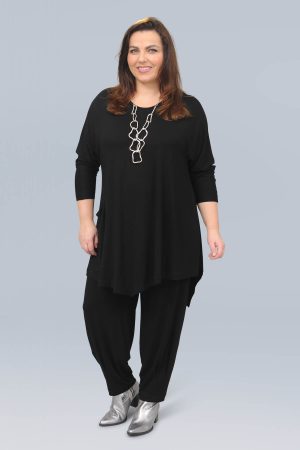 The model in this photo is wearing a Noen jersey asymmetrica top in plus sizes at Bakou