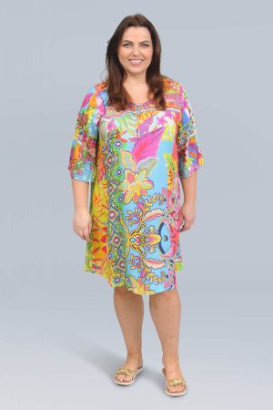 The model in this photo is wearing a light digital print dress in a bold bright print by Orientque at Bakou London