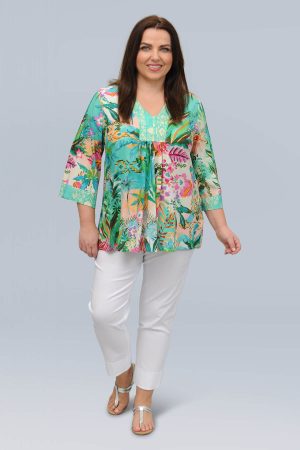 The model in this photo is wearing a cute short Orientique Hanalei top in plus sizes at Bakou London