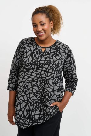 The model in this photo is wearing a funky A-line textured jersey top by plus size specialists Pont Neuf at Bakou London