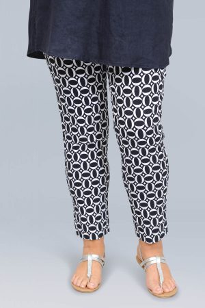 The model in this photo is wearing Robell Rose narrow patterned crop trousers in a funky navy and white circle design from Bakou London