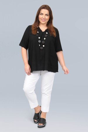 The model in this photo is wearing a gorgeous soft top by German designers See You with frayed edging in larger sizes for curvy girls available from Bakou London