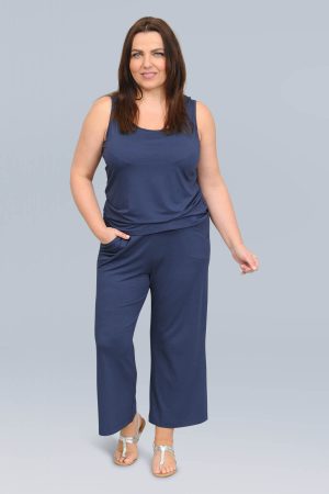 The model in this photo is wearing a navy jersey vest top from Via Appia Due at Bakou London