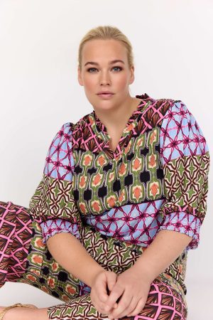 The model in this photo is wearing a Melika 1 gypsy style top by Wasabi Concept at Bakou London